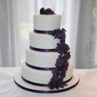 4 tier purple flowers wedding cake