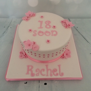 Pink buttons and flowers cake