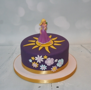Flowers &amp; sun Rapunzel cake