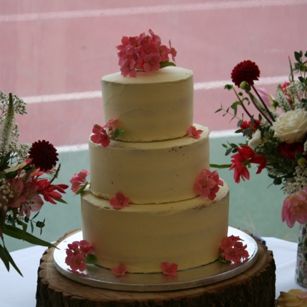 Semi-naked wedding cake with sugar hydrangeas