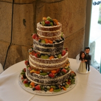 4 tier &#039;naked&#039; wedding cake with spring fruits