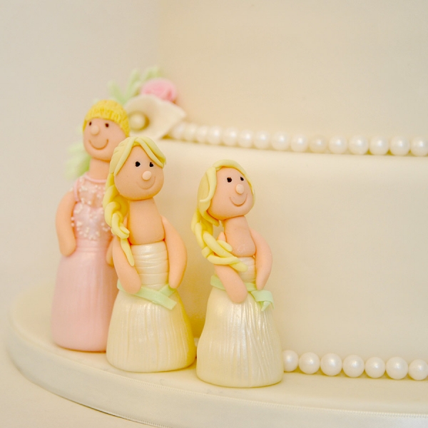 Bridesmaid on wedding cake